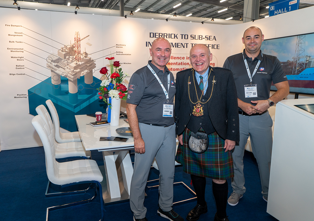 welcoming visitors to the stand